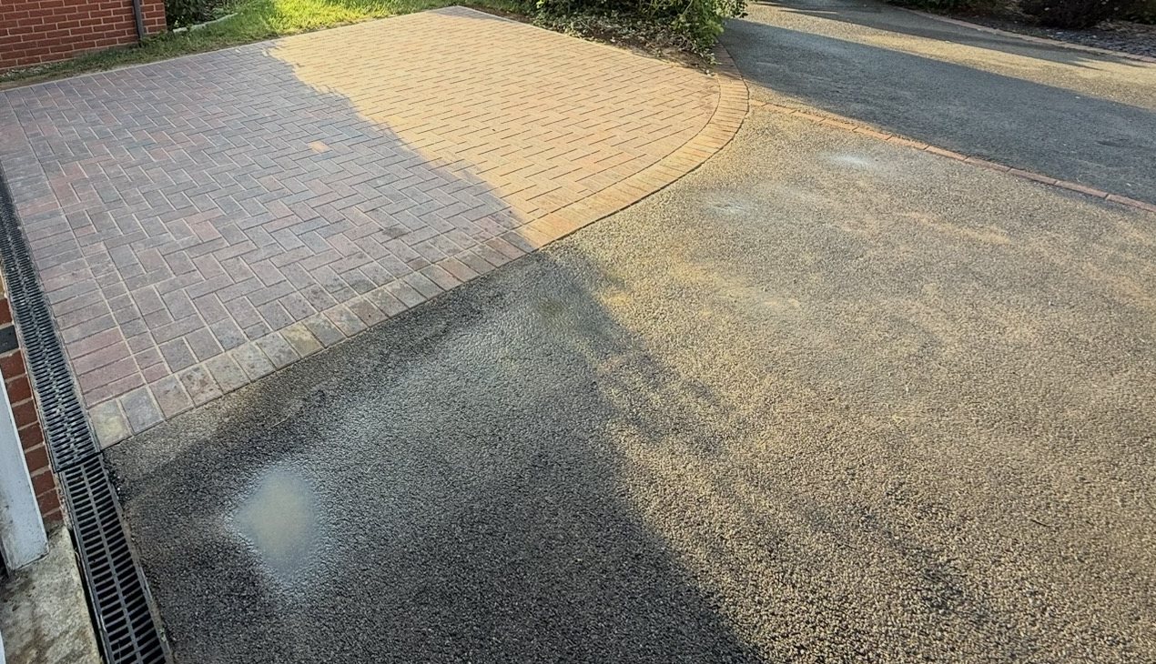The curved soldier course where the new bay meets the tarmac, with the channel drain at the garage The curved soldier course where the new bay meets the tarmac, with the channel drain at the garage