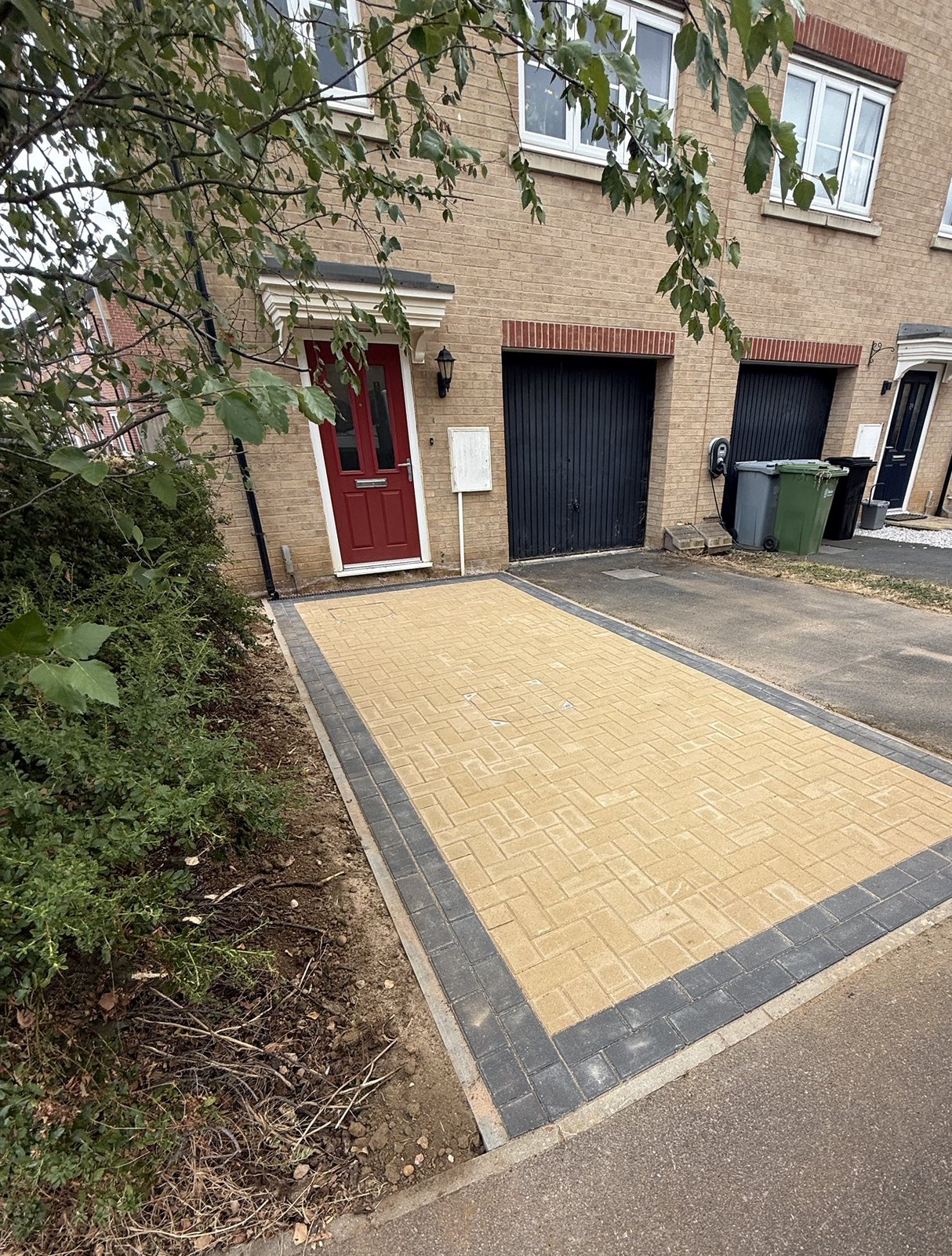 The new space alongside the existing drive and the garage The new space alongside the existing drive and the garage