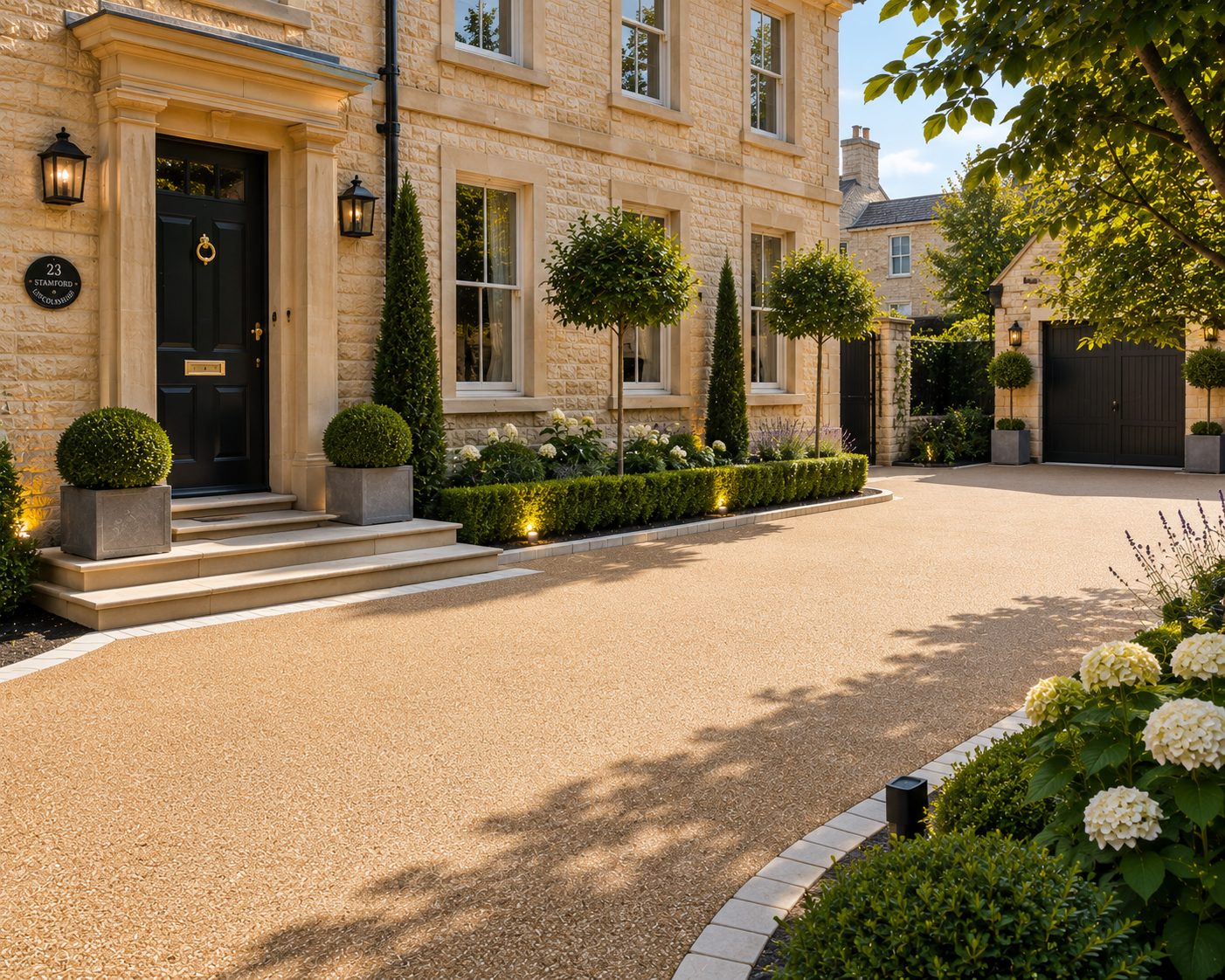 Golden resin bound driveway with curved border at a stone townhouse in Rutland